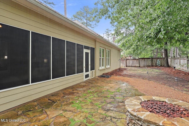 611 Berridge Dr, Ridgeland, MS 39157 - fenced backyard with a fire pit and a patio area