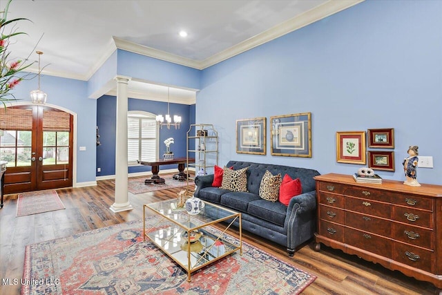 611 Berridge Dr, Ridgeland, MS 39157 - living area with ornate columns, french doors, crown molding, a chandelier, and wood finished floors
