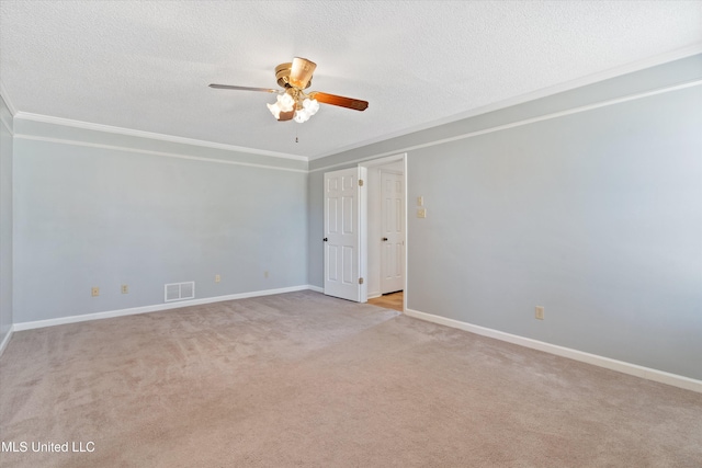 spare room featuring visible vents, a textured ceiling, and ornamental molding