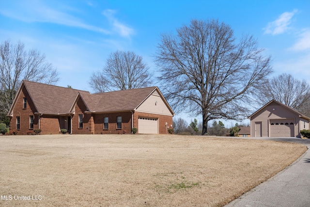 view of front facade with brick siding and a shingled roof