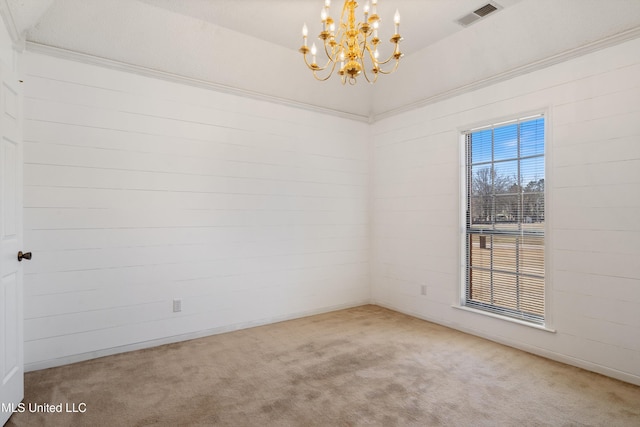 carpeted empty room with visible vents and an inviting chandelier