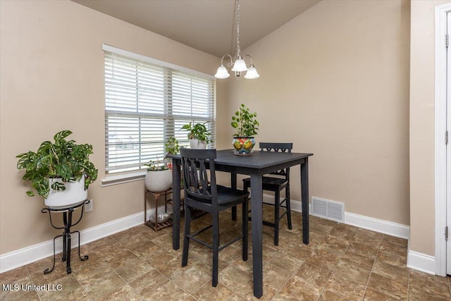 dining room with an inviting chandelier, baseboards, and visible vents