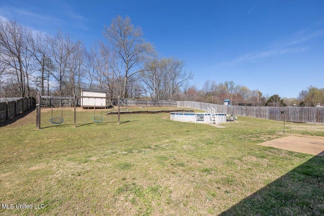 view of yard featuring a fenced backyard and a fenced in pool