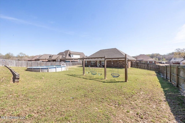 view of yard featuring a fenced backyard and a fenced in pool