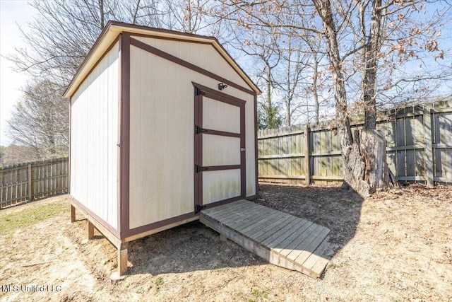 view of shed featuring a fenced backyard