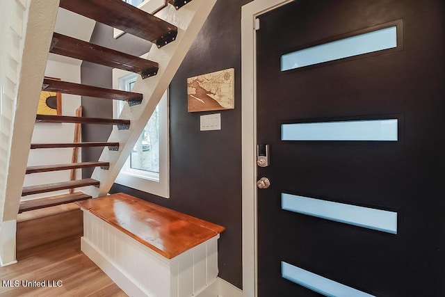 interior space featuring stairs and wood finished floors