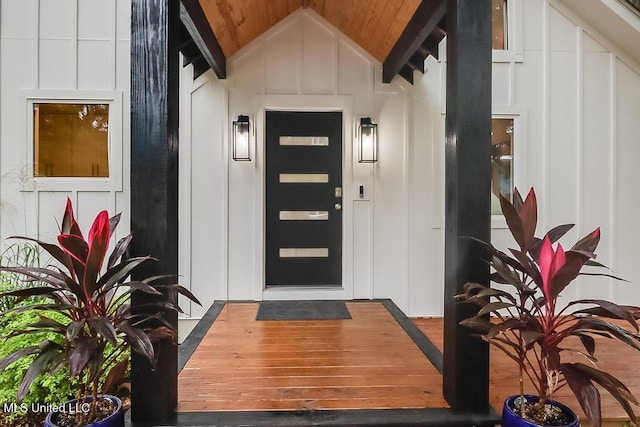 doorway to property featuring board and batten siding