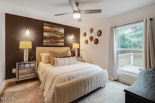 bedroom featuring baseboards and ceiling fan