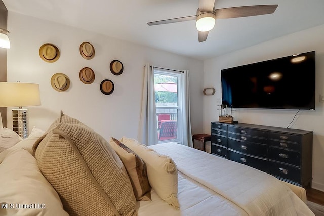 bedroom with a ceiling fan and wood finished floors