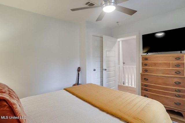 bedroom with a ceiling fan and visible vents