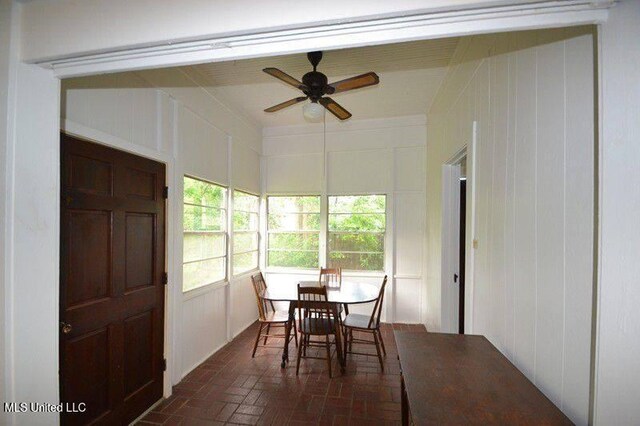 sunroom with a ceiling fan