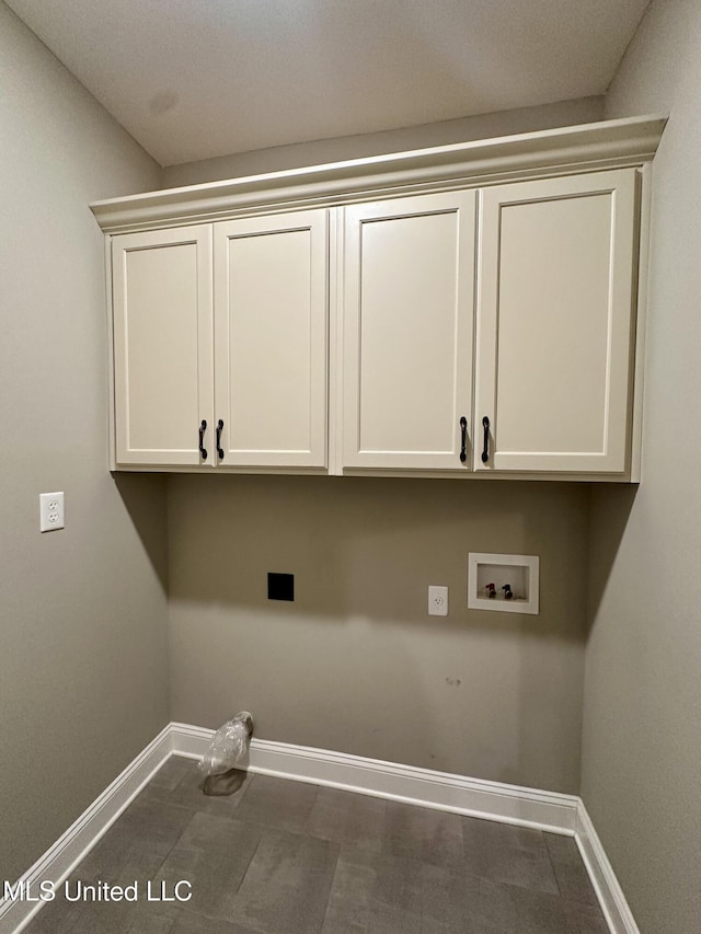 4049 Courtyard Dr, Southaven, MS 38671 - laundry area featuring baseboards, cabinet space, and hookup for a washing machine