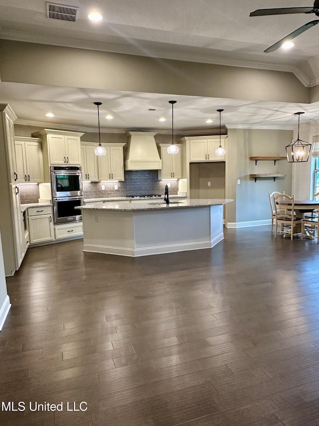 4049 Courtyard Dr, Southaven, MS 38671 - kitchen featuring wall chimney exhaust hood, ornamental molding, stainless steel double oven, decorative backsplash, and dark wood-type flooring