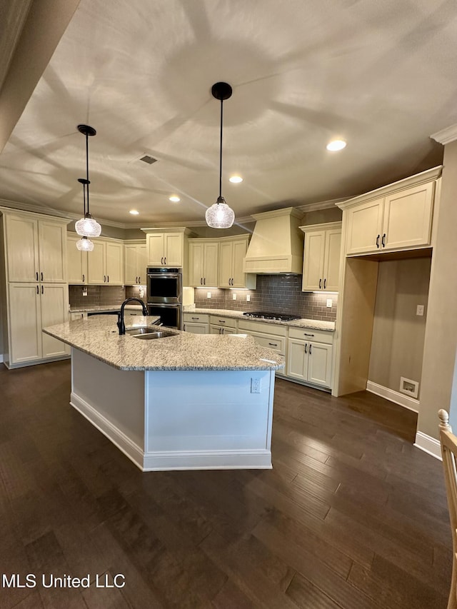 4049 Courtyard Dr, Southaven, MS 38671 - kitchen with wall chimney range hood, appliances with stainless steel finishes, tasteful backsplash, white cabinets, and recessed lighting