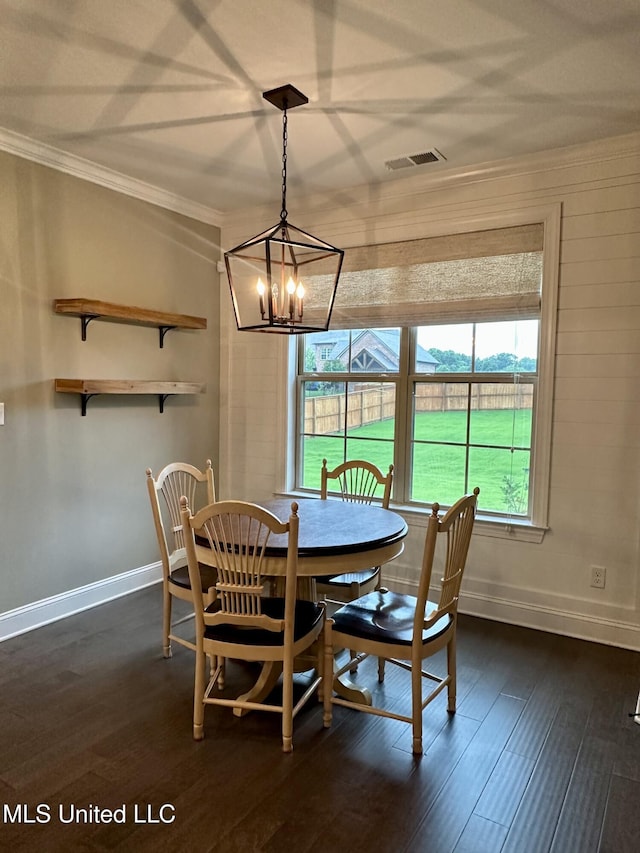 4049 Courtyard Dr, Southaven, MS 38671 - dining space with a chandelier, dark wood-style flooring, crown molding, and baseboards