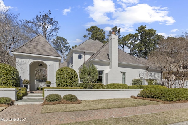 view of front of property featuring a chimney