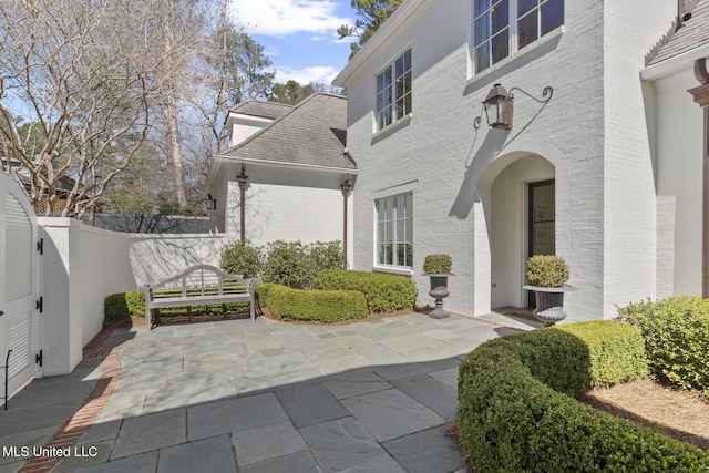 view of patio / terrace featuring fence