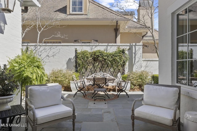 view of patio / terrace with outdoor dining area and fence