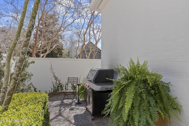 view of patio / terrace with fence and area for grilling