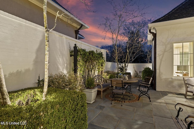 patio terrace at dusk with fence