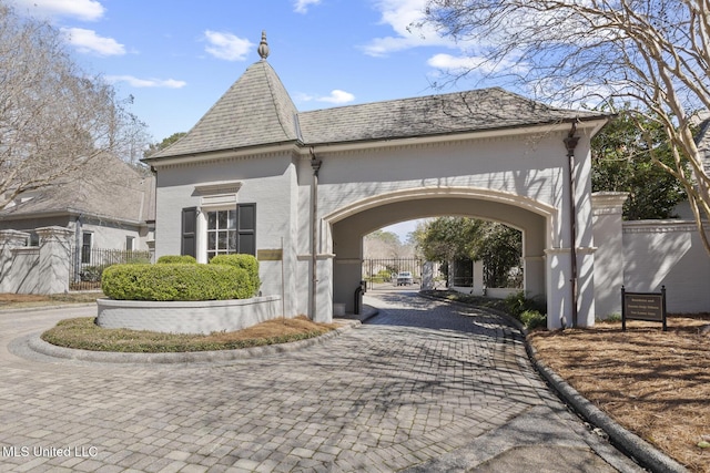 view of property's community with a gate and fence