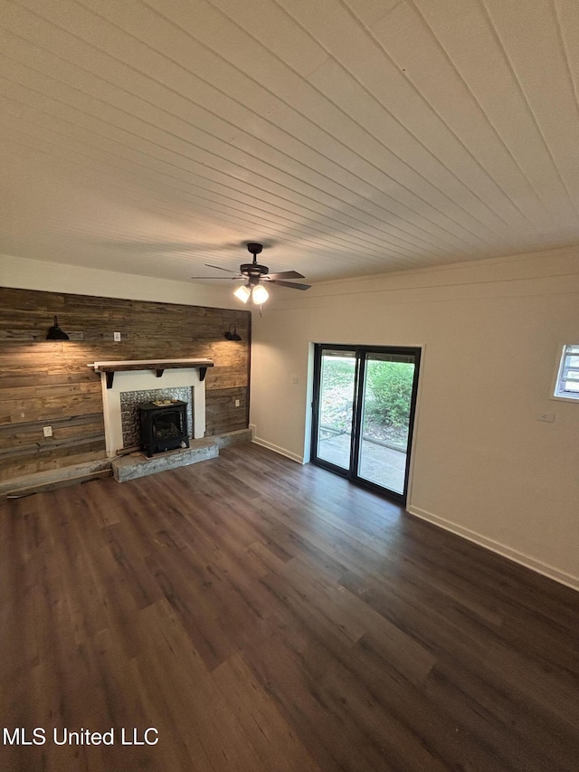 unfurnished living room with ceiling fan, wood ceiling, and dark wood-type flooring