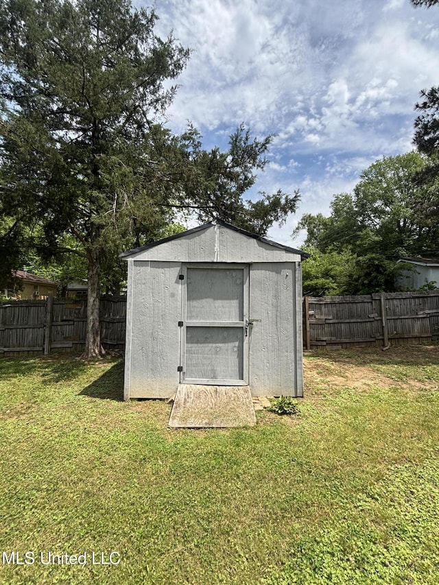 view of shed with a fenced backyard