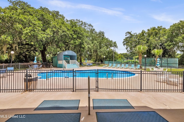 1130 Beach Blvd Unit 503, Biloxi, MS 39530 - community pool featuring a patio area and view of scattered trees