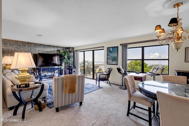 1130 Beach Blvd Unit 503, Biloxi, MS 39530 - living area with carpet, a chandelier, an accent wall, and baseboards