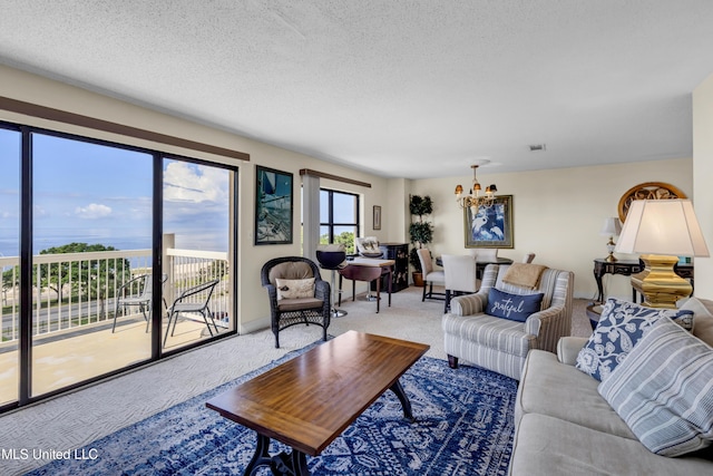 1130 Beach Blvd Unit 503, Biloxi, MS 39530 - living area with a chandelier, carpet floors, and a textured ceiling