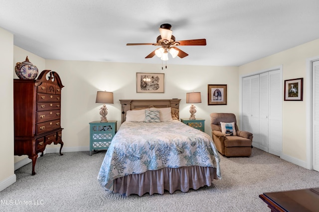 1130 Beach Blvd Unit 503, Biloxi, MS 39530 - bedroom featuring carpet flooring, baseboards, ceiling fan, and two closets