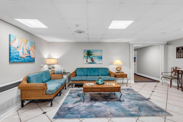 1130 Beach Blvd Unit 503, Biloxi, MS 39530 - living room featuring tile patterned flooring, a drop ceiling, and baseboards