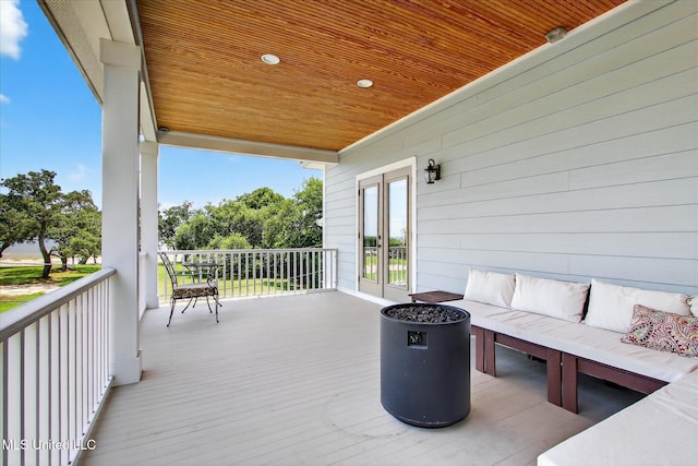 631 2nd St, Gulfport, MS 39501 - wooden deck with french doors and an outdoor hangout area