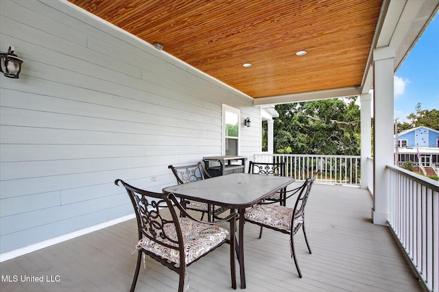 631 2nd St, Gulfport, MS 39501 - wooden terrace with outdoor dining space
