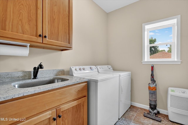 631 2nd St, Gulfport, MS 39501 - washroom with cabinet space and independent washer and dryer