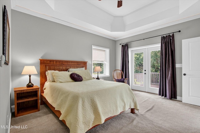 631 2nd St, Gulfport, MS 39501 - bedroom featuring light colored carpet, access to exterior, a tray ceiling, a ceiling fan, and ornamental molding