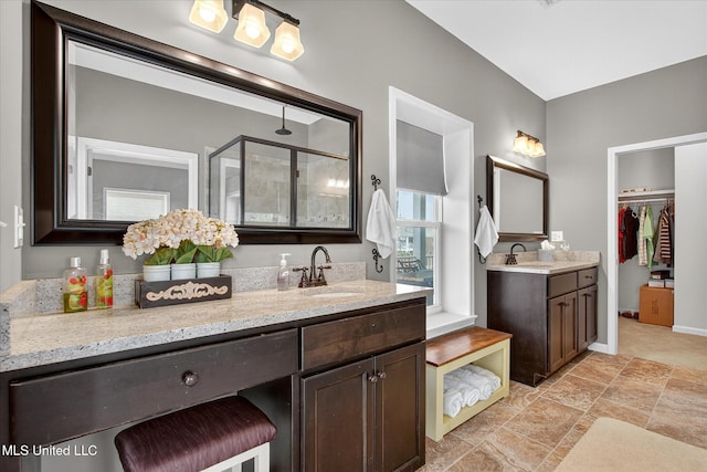 631 2nd St, Gulfport, MS 39501 - full bathroom with a stall shower, two vanities, and a walk in closet