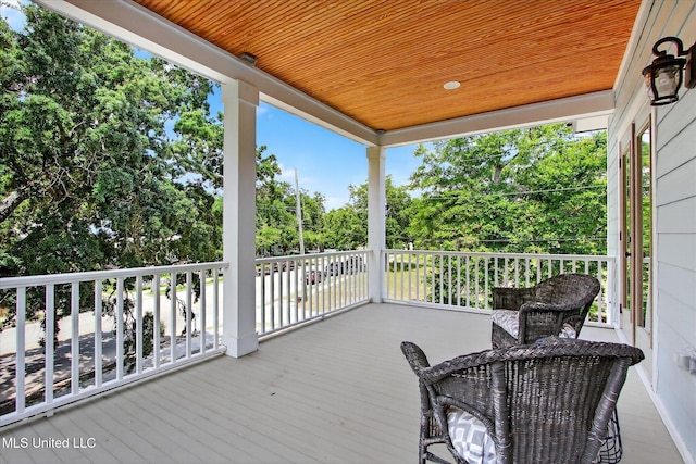 631 2nd St, Gulfport, MS 39501 - wooden deck featuring view of scattered trees