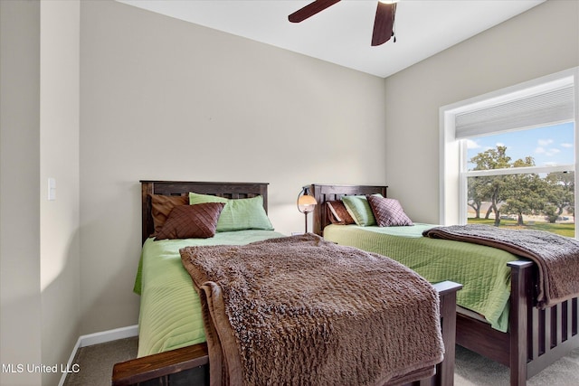 631 2nd St, Gulfport, MS 39501 - carpeted bedroom featuring baseboards and a ceiling fan