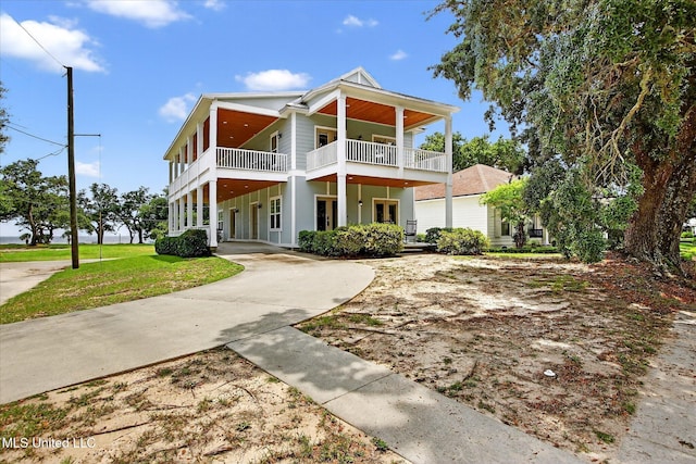 631 2nd St, Gulfport, MS 39501 - view of front of home with a balcony and a front yard