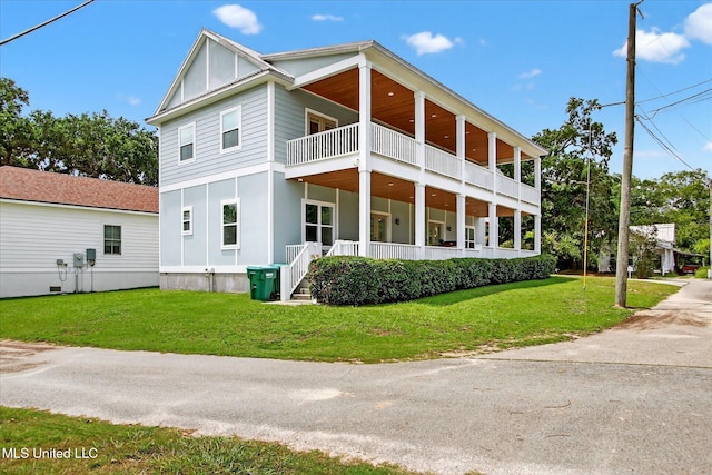 631 2nd St, Gulfport, MS 39501 - back of house featuring a balcony, a yard, and a porch