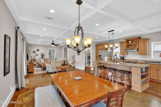 631 2nd St, Gulfport, MS 39501 - dining space with coffered ceiling, a chandelier, beamed ceiling, a ceiling fan, and recessed lighting