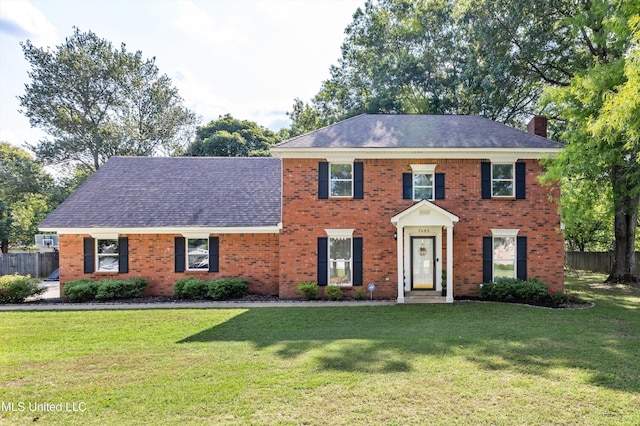 7465 Davidson Rd, Olive Branch, MS 38654 - colonial house with a chimney, brick siding, and a shingled roof