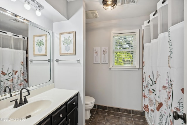 7465 Davidson Rd, Olive Branch, MS 38654 - bathroom featuring vanity, toilet, tile patterned floors, and curtained shower