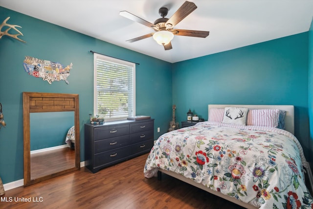 7465 Davidson Rd, Olive Branch, MS 38654 - bedroom with wood finished floors, baseboards, and ceiling fan