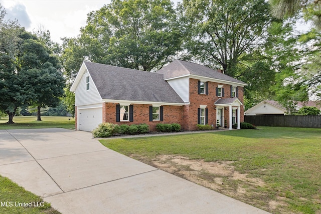 7465 Davidson Rd, Olive Branch, MS 38654 - view of front of house with brick siding, roof with shingles, concrete driveway, and a garage