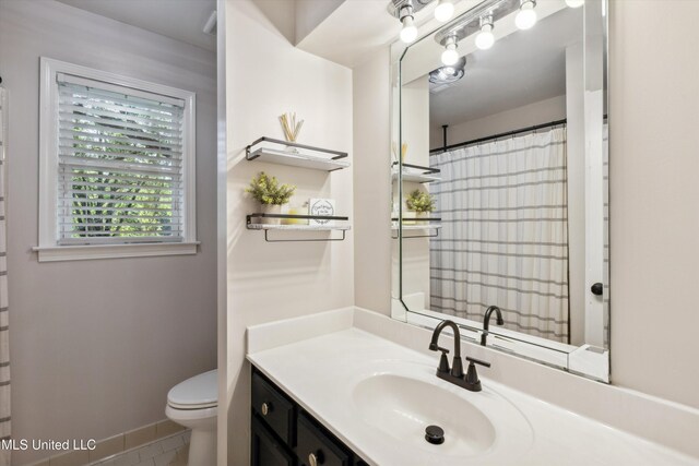 7465 Davidson Rd, Olive Branch, MS 38654 - full bathroom with vanity, toilet, and a shower with shower curtain
