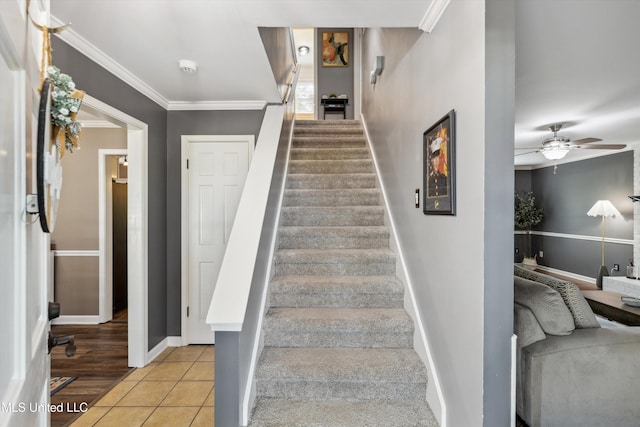7465 Davidson Rd, Olive Branch, MS 38654 - stairway featuring crown molding, baseboards, ceiling fan, and tile patterned floors