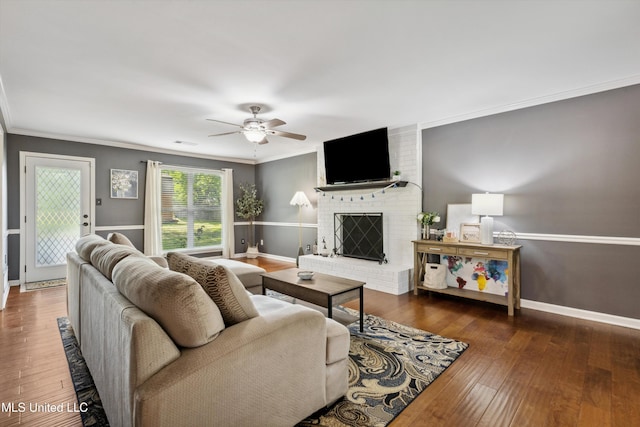 7465 Davidson Rd, Olive Branch, MS 38654 - living area with ceiling fan, a fireplace, hardwood / wood-style floors, ornamental molding, and baseboards