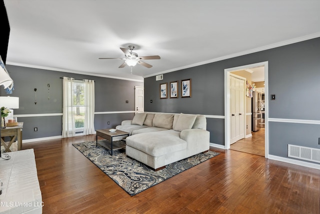 7465 Davidson Rd, Olive Branch, MS 38654 - living area with ceiling fan, wood finished floors, ornamental molding, and baseboards